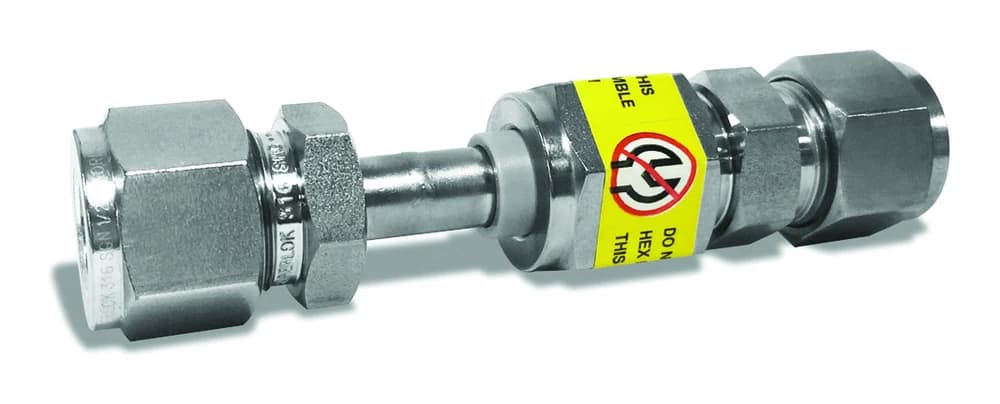 BMT SUPERLOK dielectric fitting with insulating center section and identification label.