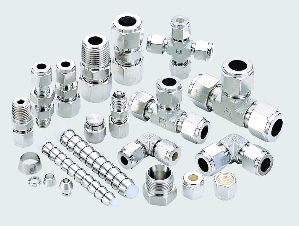 Manufacturer photograph group of SUPERLOK double-ferrule tube fittings and spare parts.